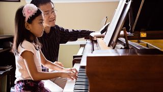 Akira Ikegami teaching a piano student